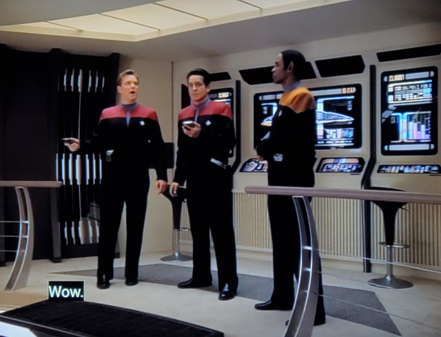 Star Trek Voyager scene. Tuvok, Chakotay, and Tom "Salamander" Paris walk into a bar, er, I mean they are standing on the bridge of a starfleet vessel. But not the usual Voyager bridge, it's DIFFERENT. In usual uniforms, they all appear to be taking in the room and looking around/scanning with their fancy tricorders. Picture one, Paris is wide eyed and speaking, closed caption reads, "Wow." 
Picture two, Tuvok responding, closed caption reads, "Wow, indeed."