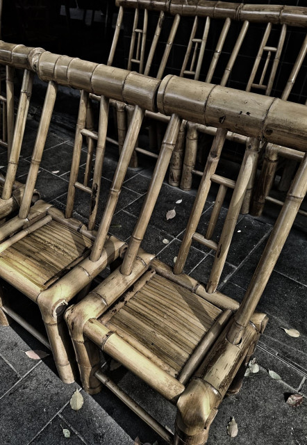 Rows of thick bamboo chairs