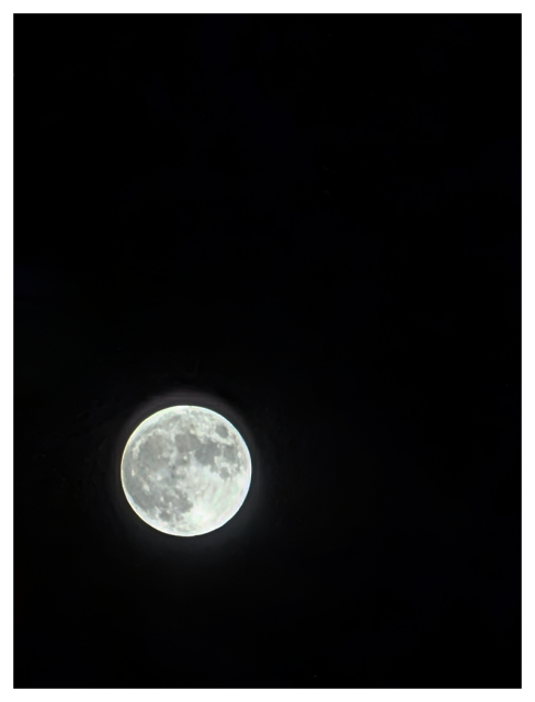 a full moon against a black sky in the lower left third of the image