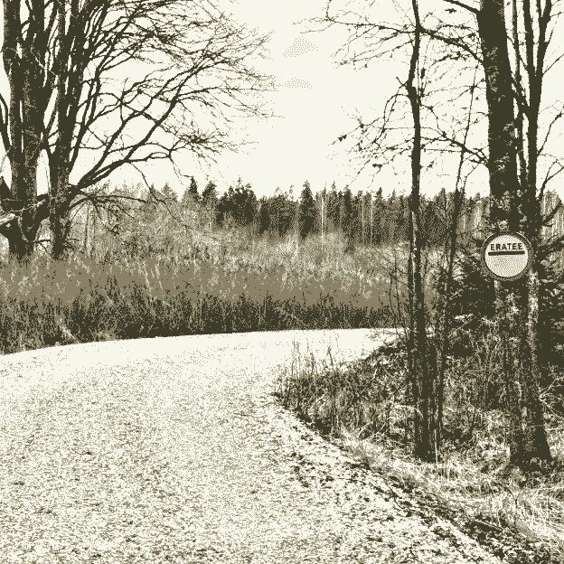 a gravel road winds through the forest. on the right, a "private road" sign reads "eratee" (est.)