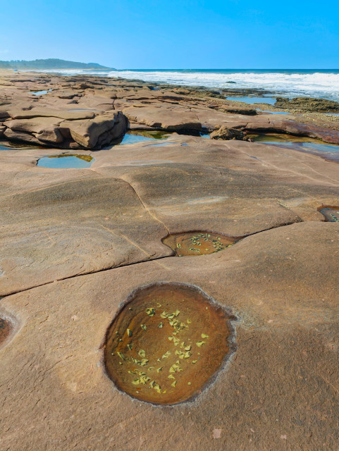 A crater-like rock formation at Pennington Beach, South Africa