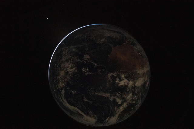 From NASA on X:

In this image of Earth taken by the Artemis II crew, we can see the electric lights of human activity. In the lower right, sunlight illuminates the limb of the planet.

Note: Distance between Orion and Earth in these 3 posts were calculated using the tool from NASA at https://eyes.nasa.gov/apps/solar-system/#/sc_artemis_2