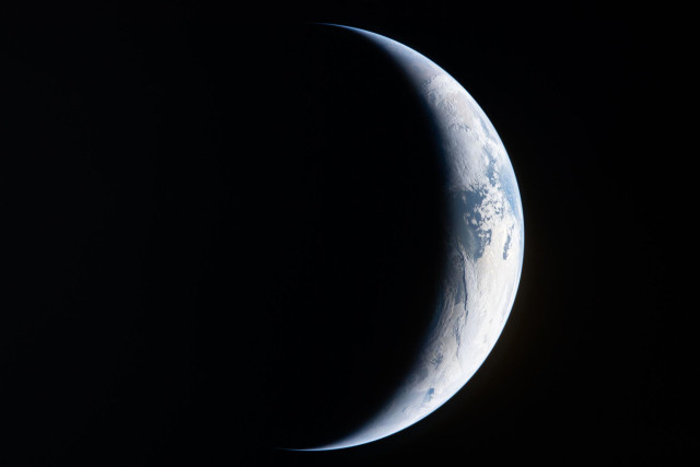(legend pasted from original website)
Our Home Planet

art002e004462 (April 4, 2026) - A sliver of Earth is illuminated against the blackness of space in this photo taken by an Artemis II crew member through an Orion spacecraft window. Credit: NASA