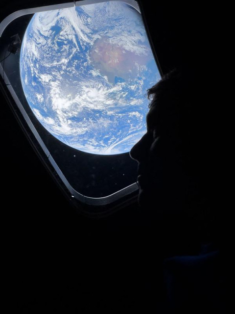 (same)
Home, Seen from Orion.

art002e009007 (April 4, 2026) - NASA astronaut and Artemis II Commander Reid Wiseman peers out of one of the Orion spacecraft's main cabin windows, looking back at Earth, as the crew travels towards the Moon. Credit: NASA