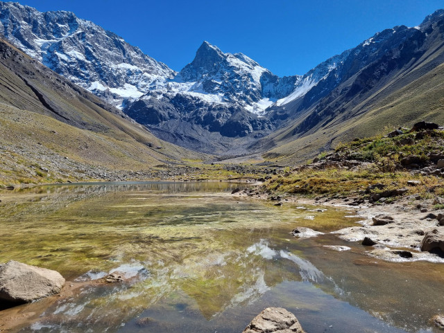 Lake with the reflection of the mountains in the background