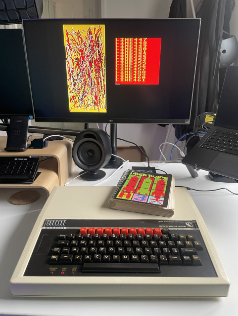 Photo of a BBC Micro B running a little BASIC program that draws lines.