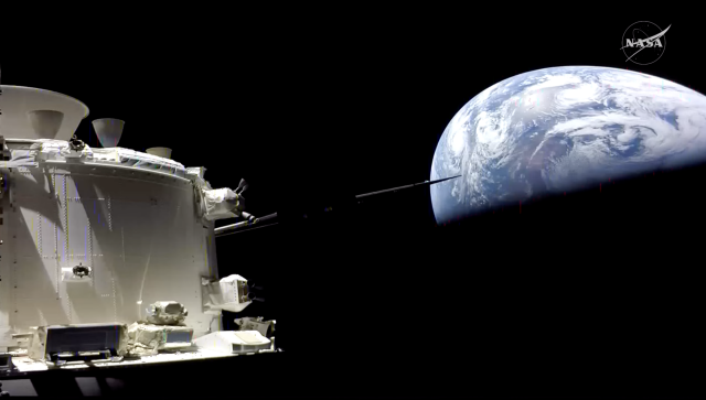 A picture of earth and Artemis 2 taken from the Artemis 2 onboard camera, with an angle that really does make the Earth look like a fl4t disc because of camera distortion. sorry for the inline 4, I just don't want it easier for the f-lat earth lunes to find.