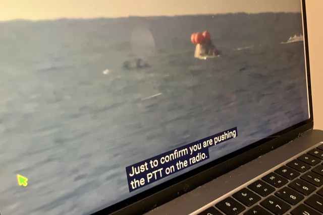 A screenshot of the Integrity Orion capsule bobbing in the ocean. Caption says “Just to confirm you are pushing the PTT on the radio”