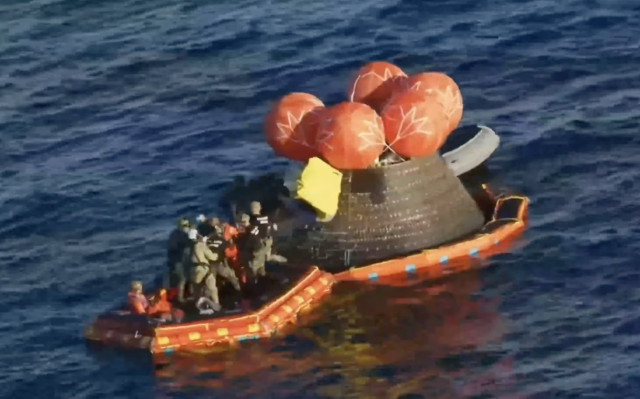 the front porch and capsule two crew members on the porch but it's impossible to see who is who