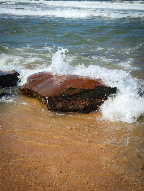 Waves crashing on a rock, Pennington Beach, South Africa