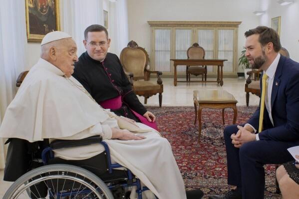 Pope Francis in a wheelchair talking to Vance: 