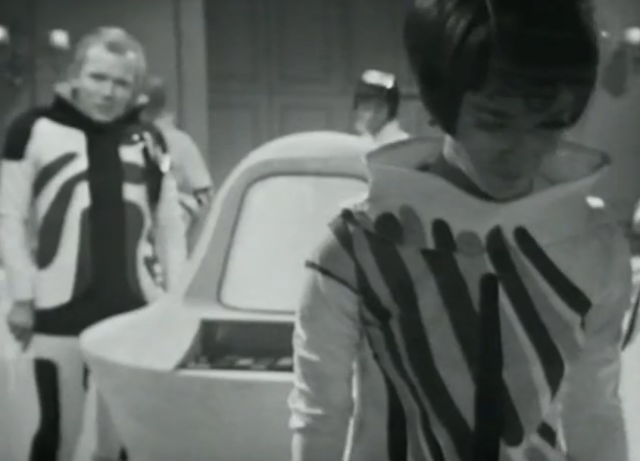 Two figures covered in swirls.