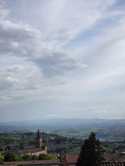 The view from Perugia's old town looking out over rolling Italian hills.