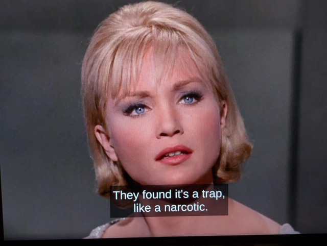 Screenshot: a beautiful blond woman says: "It's a trap."