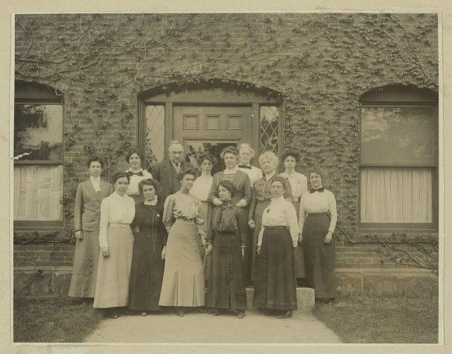 The Harvard Computers standing in front of Building C at the Harvard College Observatory, 13 May 1913.

Photograph of the Harvard Computers, a group of women who worked under Edward Charles Pickering at the Harvard College Observatory. The photograph was taken on 13 May 1913 in front of Building C, which was then the newest building at the Observatory. The image was discovered in an album which had once belonged to Annie Jump Cannon. Image courtesy of the Harvard-Smithsonian Center for Astrophysics. Back row (L to R): Margaret Harwood (far left), Mollie O'Reilly, Edward C. Pickering, Edith Gill, Annie Jump Cannon, Evelyn Leland (behind Cannon), Florence Cushman, Marion Whyte (behind Cushman), Grace Brooks. Front row: Arville Walker, unknown (possibly Johanna Mackie), Alta Carpenter, Mabel Gill, Ida Woods.

https://en.wikipedia.org/wiki/Harvard_Computers#/media/File:Edward_Charles_Pickering's_Harem_13_May_1913.jpg