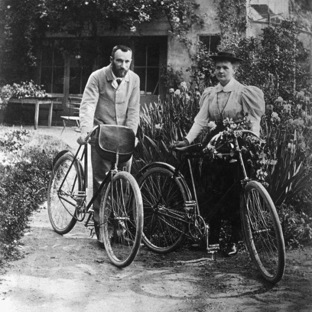 Pierre and Marie outdoors with their bicycles, during their honeymoon.