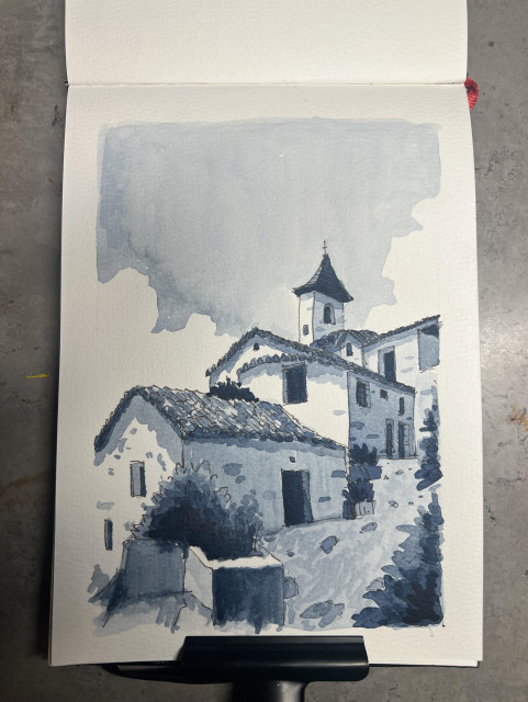 Watercolor sketch in indigos blue of a little rustic group of houses in a Greek style with a church tower of some sort towering over it