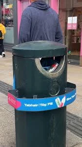 Dublin street trashcan with a ledge around it where you can put drink cans and bottles with deposit instead of trashing them