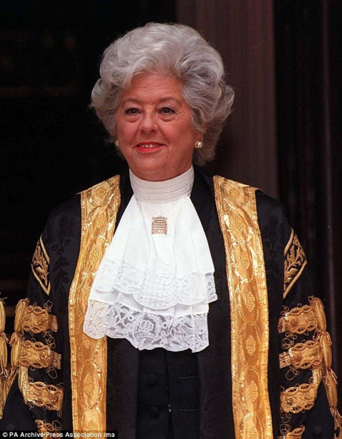Betty Boothroyd in her Speaker's robes in the 1990s. She is a white woman with grey hair in some very bling black and gold robes.
