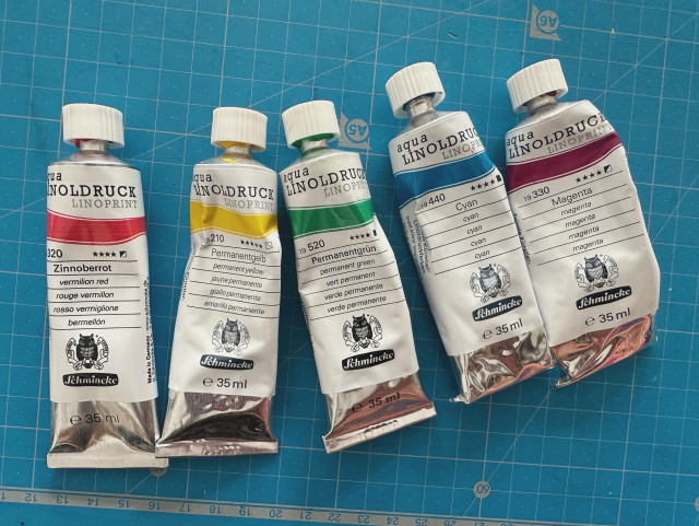 5 tubes of linocut ink from schminke : red, yellow, green, blue and magenta 