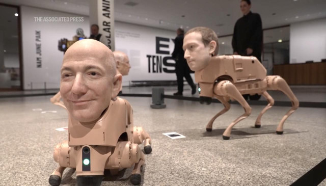 “Robot dogs with hyper-realistic silicone heads modeled after world-renowned figures — including Elon Musk, Mark Zuckerberg, Jeff Bezos, Andy Warhol and Pablo Picasso — can be seen roaming around a Berlin museum, occasionally “pooing” printed images of their surroundings which they’ve previously captured with integrated cameras.”

source https://apnews.com/article/germany-berlin-robot-dogs-beeple-bezos-digital-art-4a2be2a4a4490553ad68c27beedfe83a