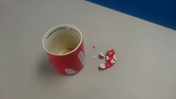 A mug with a handle that's broken into many pieces