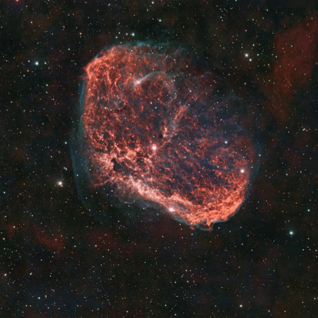 Caldwell 27 -  AKA The Crescent Nebula
Gas outflows from the Wolf-Rayet star at the center of this thing get ionized by the UV emissions of the same star, glowing in red (Hydrogen) and blue/green (Oxygen).