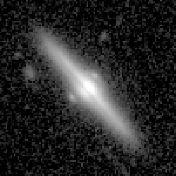 Euclid data: A spiral galaxy seen edge on, with a dust lane in the center and two small patches outside its bulge.