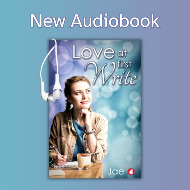 Love at First Write by Jae is now out as an audiobook. Pictured is the cover, a young, blonde woman, who is smiling and looking off into the distance, while she thinks about a story idea, sitting with a notepad and a pen. 