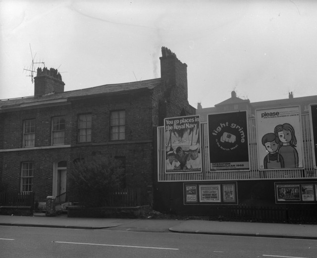 b/w street photo including film poster for: Saturday Night and Sunday Morning / Planet of the Apes  