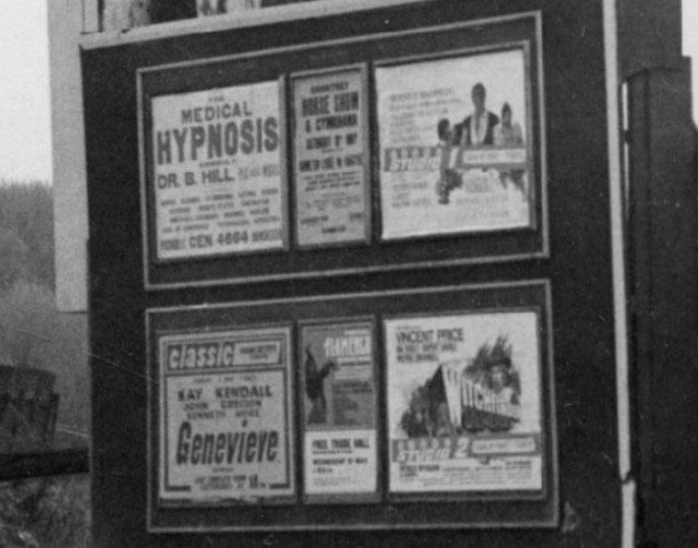 b/w street photo including film poster for: ? / Genevieve / Witchfinder General  / Doctor Faustus (close up)