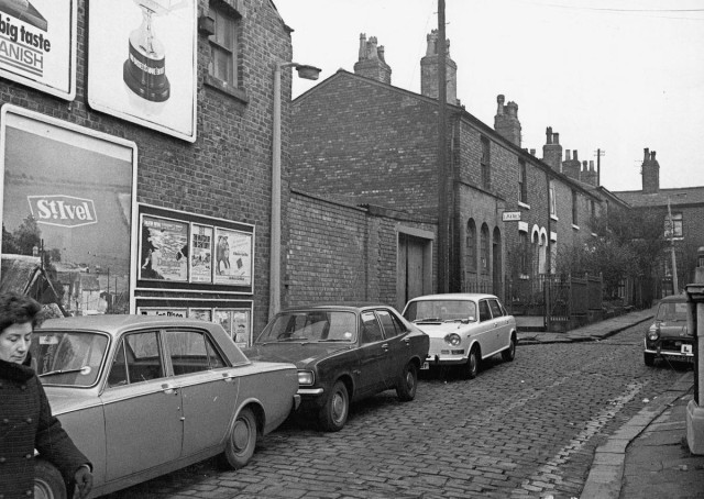 b/w street photo including film poster for: Ryan's Daughter / Love Story  