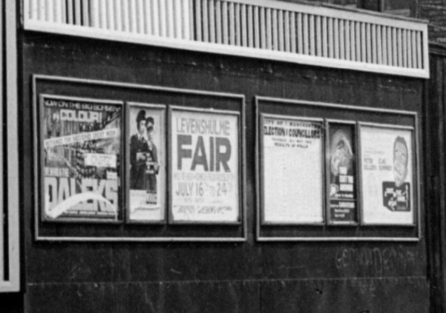 b/w street photo including film poster for: Dr. Who & the Daleks / A Shot in the Dark   (close up)