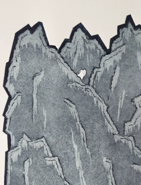 Right at the top of the print there is a tiny arctic fox peeking out from behind one of the craggy sharp mountains