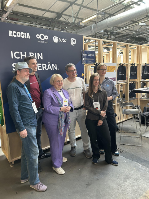 Group picture with Katja Mast at the booth of Ecosia, Nextcloud, Tuta, and Mastodon