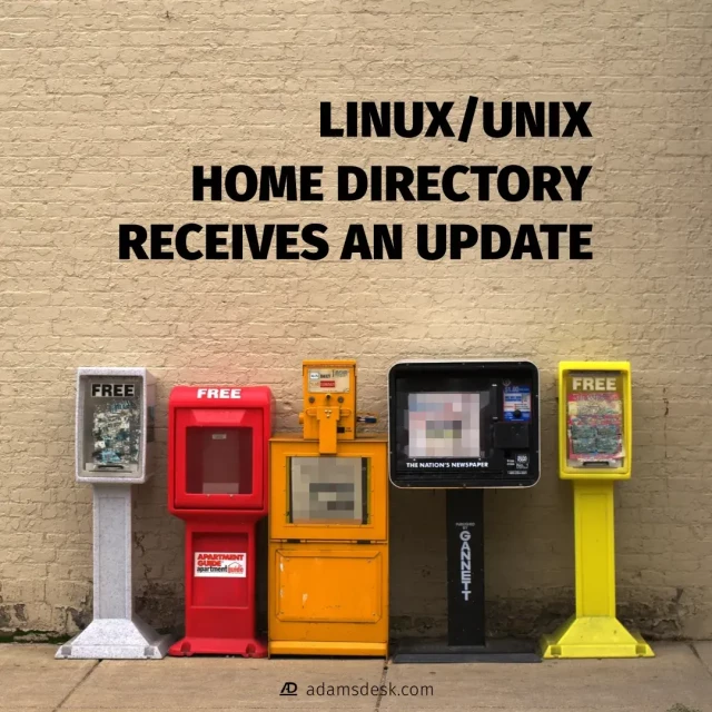 A beige brick wall running parallel to a concrete sidewalk with five newspaper vending machines lined up side-by-side with a bold title of 'Linux/Unix Home Directory Receives an Update'.