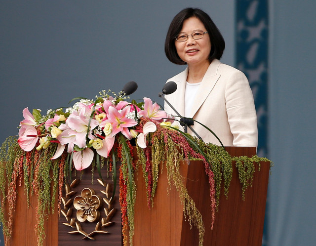 Tsai Ing-wen at her first inauguration. She is a Taiwanese woman with straight black hair in a bob. 
