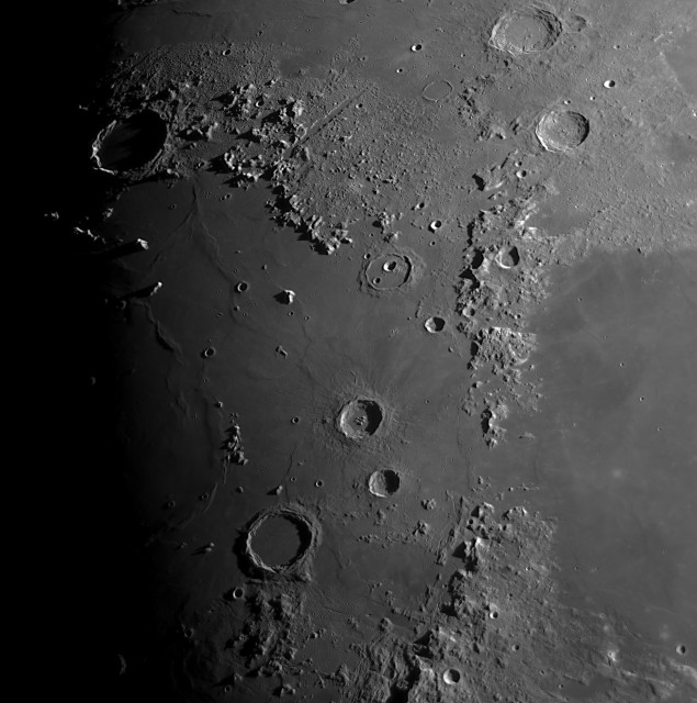 Picture of a region of the moon through a telescope. Here is Mare Imbrium, a large plain, with Montes Alpes, a mountain range north of the Mare. There is a large canyon-like feature among those mountains, it is called Vallis Alpes.  