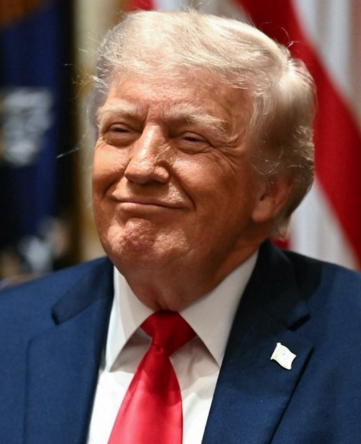 Trump grinning insanely like the joker.