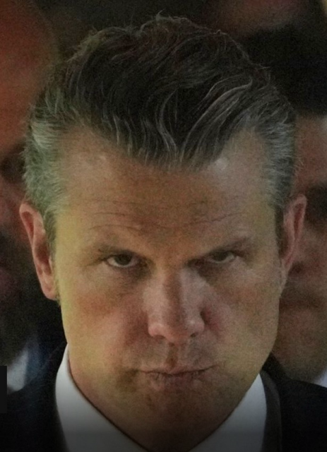 Hegseth staring menacingly straight into the camera like a crazy Batman villain or Hannibal Lecter.