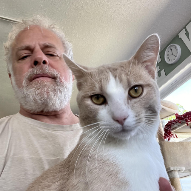 man and cat