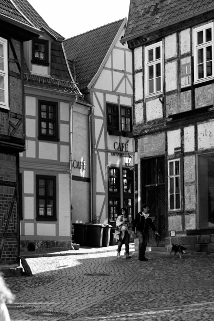 People walking in a small square in the old town of Quedlinburg