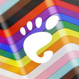 White GNOME logo on progress flag wallpaper. This is one of the default wallpapers in GNOME.
