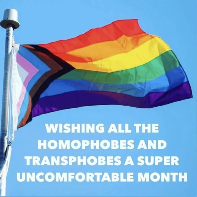 A Progress Pride flag, flying, with a sky blue background. There is text the same as per the post.