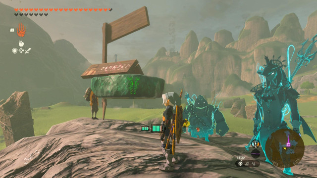 A Birkda sign with the support of a hover stone