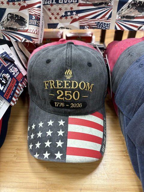 A hat with the words

"Freedom 250

1776-2026"