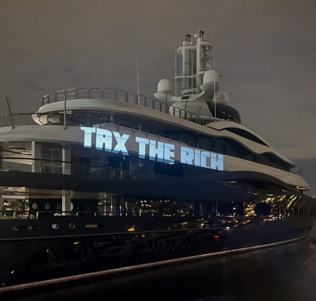 Mark Zuckerbergs' yacht onto which someone projected the words "Tax The Rich"