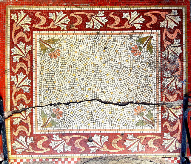 A threshold mosaic in an Edwardian pub in Glasgoe with a floral border.