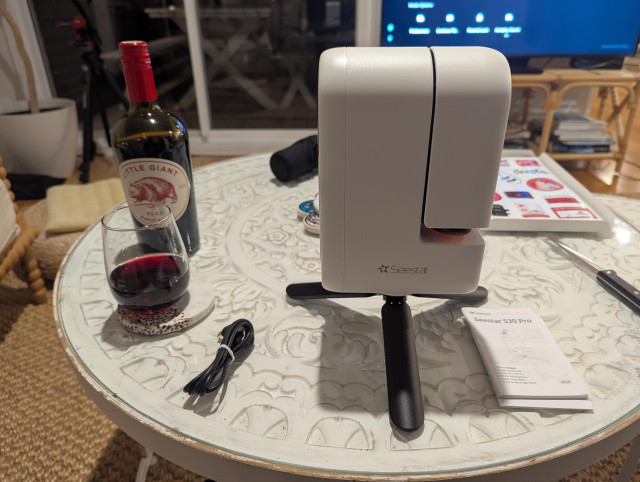 Photo of a Seestar S30 Pro "smart telescope" on a table