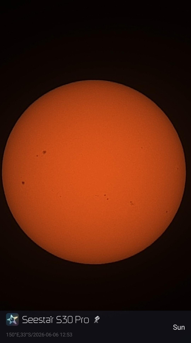 Image of the Sun from a Seestar S30 Pro smart telescope. Some sunspots are visible.